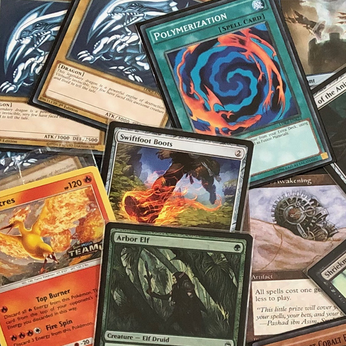 CCGs image, featuring a variety of cards from Magic: The Gathering and Yu-Gi-Oh. Sadly there are no Netrunner cards, but that is popular within the society.